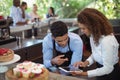 Male waiter and female waitress with digital tablet Royalty Free Stock Photo