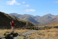 Male walker on mountain footpath in Lake District Royalty Free Stock Photo