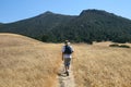 Male walking down a trail