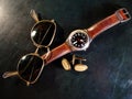 Male watch, cuff buttons and sunglasses