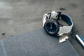 Male watch and notepad on dark grey table