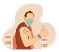 Male wearing mask showing thumbs up sign after receiving vaccine