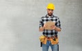 Male worker or builder in helmet with clipboard Royalty Free Stock Photo