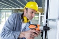 male worker carpenter at internal door installation