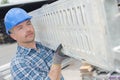 male worker carrying girder