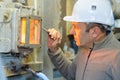 Male worker checking fire factory