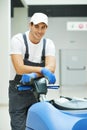 Male worker cleaning business hall Royalty Free Stock Photo