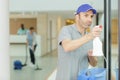 male worker cleaning hospital windows Royalty Free Stock Photo
