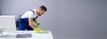 Male Worker Cleaning Office Royalty Free Stock Photo