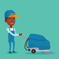 Male worker cleaning store floor with machine. Royalty Free Stock Photo