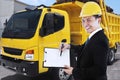 Male worker with clipboard and delivery truck Royalty Free Stock Photo