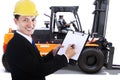 Male worker with clipboard and forklift