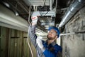 Male Worker Connecting Cables Royalty Free Stock Photo