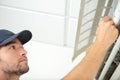 male worker fixing airconditioning