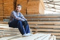 Male Worker folds boards. Sawmill. Wood harvesting process