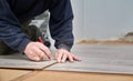 Male worker hands drawing line on laminate panel. Royalty Free Stock Photo