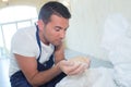 Male worker holding handful grains