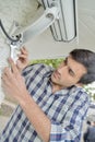 male worker installing video camera