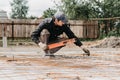 male worker measures the construction level of rebar for the foundation Royalty Free Stock Photo