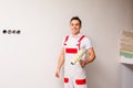 Male worker is preparing to paint the wall Royalty Free Stock Photo