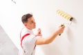 Male worker is preparing to paint the wall Royalty Free Stock Photo