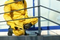 Male worker in protective suit spraying insecticide on stairs outdoors. Pest control Royalty Free Stock Photo