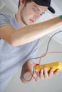 male worker reading voltmeter Royalty Free Stock Photo