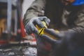 Male worker repairing Stone, edge sharpening in ski service workshop, sliding surface of the skis. sharpening of an edging of a mo