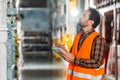 male worker in safety vest writing in notepad Royalty Free Stock Photo