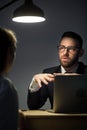 Male worker talking to colleague explaining company plans Royalty Free Stock Photo