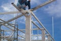 Male worker use metal cutting spark or Oxyfuel Gas cutting on steel roof truss with flash on blue sky background.