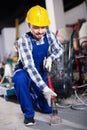 Male worker using jackhammer for construction work Royalty Free Stock Photo
