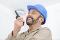 male worker using walkie-talkie with colleague Royalty Free Stock Photo