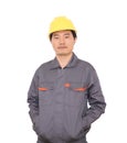 Male worker wearing yellow hard hat in front of white background Royalty Free Stock Photo