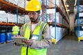 Male worker working on digital tablet in warehouse Royalty Free Stock Photo