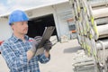 Male worker writing inventory