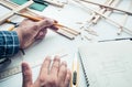 Male working on worktable with balsa wood material. Royalty Free Stock Photo