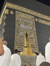 Male worshipers pray at the door of the Kaaba in the Grand Mosque of Mecca