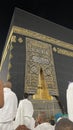 Male worshipers pray at the door of the Kaaba