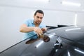 Male wrapper cuts car tinting, tuning service Royalty Free Stock Photo