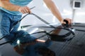 Male wrapper cuts car tinting, tuning service Royalty Free Stock Photo