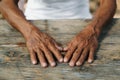 Male wrinkled hands, old man is wearing Royalty Free Stock Photo