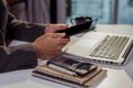 Male writes information businessman working on tablet.