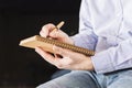 Male writing in notepad Royalty Free Stock Photo