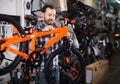 Male 28-39 years old is working on master bicycle assembly Royalty Free Stock Photo