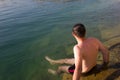 Male young swimmer on the water - summer sea