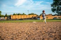 Male youth running bases after hitting the baseball. Royalty Free Stock Photo