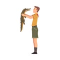 Male Zoo Worker holding Little Crocodile, Veterinarian or Professional Zookeeper Character Caring of Wild Animals in Zoo