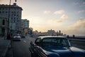 Malecon typical view in sunset with La Havana buildings at background, Cuba