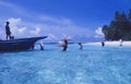 Maledives: A boat full of sand bags is unloaded to upraise and stabalise the beach on Ihuru Island